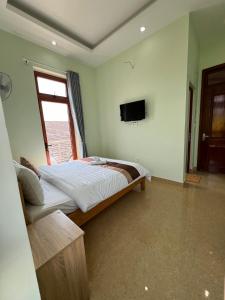 TV a/nebo společenská místnost v ubytování Alex Home Đà Lạt