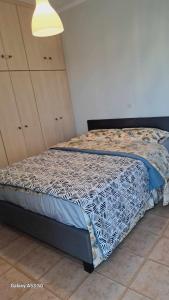 Postel nebo postele na pokoji v ubytování Paralio Place