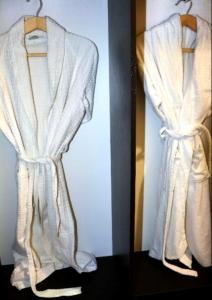 two pictures of a white robe hanging on a wall at Hotel Tajikgrey Dushanbe in Dushanbe