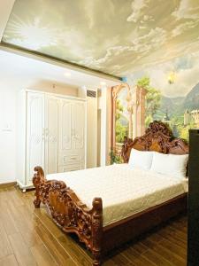 a bedroom with a bed with a painting on the wall at AuLe Dorm Room in Ho Chi Minh City