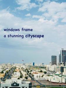 a city with the words windows frame a stunning cityscape at lagoon view-Entire apartment in Sharjah