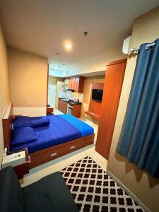 Ένα ή περισσότερα κρεβάτια σε δωμάτιο στο Apartemen Grand Kamala Lagoon by Abel Stay Luxury