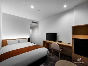 Postel nebo postele na pokoji v ubytování Daiwa Roynet Hotel Omiya-nishiguchi
