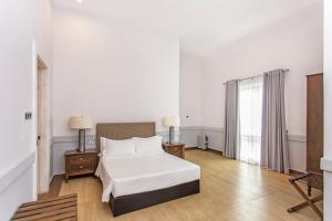 Ένα ή περισσότερα κρεβάτια σε δωμάτιο στο W15 Glenfall Nuwara Eliya
