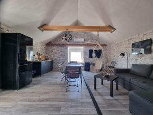 a living room with a couch and a table at Vila Kyra in Rtina