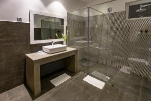 a bathroom with a sink and a shower at W15 Glenfall Nuwara Eliya in Nuwara Eliya