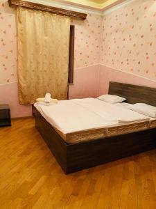 Ein Bett oder Betten in einem Zimmer der Unterkunft Villa Hotel