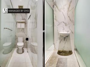 a bathroom with a toilet and a sink at Super OYO Flagship 90775 I Sleep Hotel Bandung in Bandung