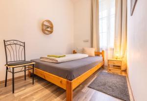 Letto o letti in una camera di Gellerico Rooms at Deák Square