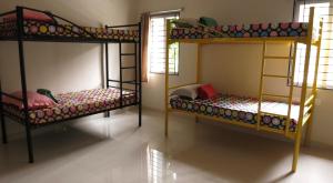 a room with two bunk beds in a room at White Camel companies in Hyderabad