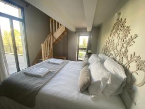Postel nebo postele na pokoji v ubytování La Maison de l'Olivier