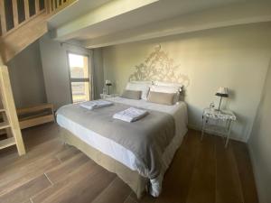 Postel nebo postele na pokoji v ubytování La Maison de l'Olivier