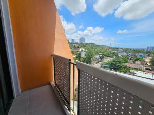 a balcony with a view of a city at Tsai Hotel and Residences in Cebu City