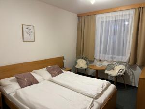 Postel nebo postele na pokoji v ubytování Apartmány KiRi