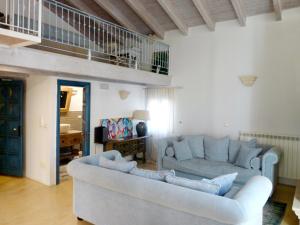 a living room with two couches and a balcony at Palazzo San Giuseppe in Nardò