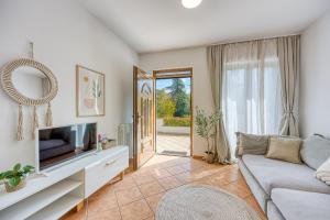 TV a/nebo společenská místnost v ubytování Casa Mareva