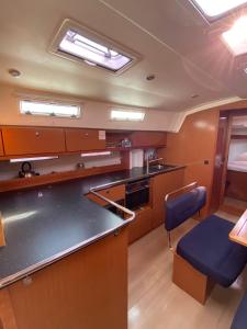 a kitchen with a sink and a counter top at Bavaria 45 Cruiser Prive huur incl. schipperservice in Sukošan