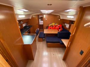 a small room with a couch and a table at Bavaria 45 Cruiser Prive huur incl. schipperservice in Sukošan