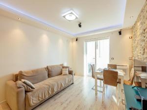 a living room with a couch and a table at Apartment Petit Jolie in Herceg-Novi +39 photos