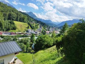 a town in a valley with mountains in the background at Fewo Alpenblick | Pool | Bergblick in Berchtesgaden