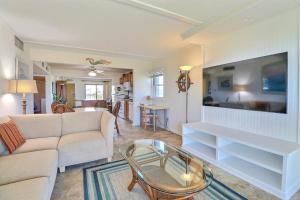 a living room with a couch and a table at DL104 Dunes Watch Oceanfront in Nags Head