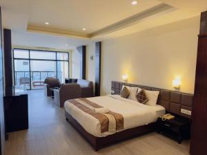 a bedroom with a bed and a living room at Tara valley view in Gangtok