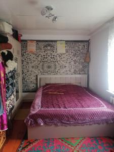 En eller flere senge i et værelse på Mariyam Guest House