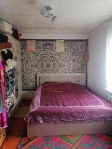 Postel nebo postele na pokoji v ubytování Mariyam Guest House