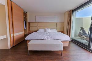Rúm í herbergi á Hotel Muralto Locarno