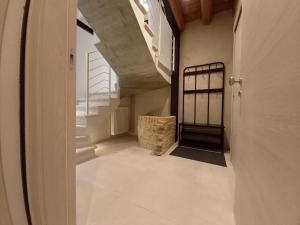 an empty hallway with a staircase in a house at Ca' Santina in Cittadella