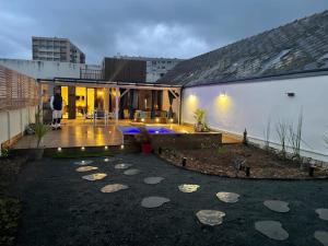 a person standing on a patio of a house at Le 627 in Saumur