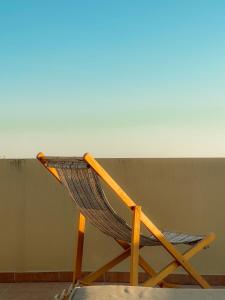 a hammock chair sitting in front of a wall at Casa Maria-Anneta in Kalives Poligirou +157 photos