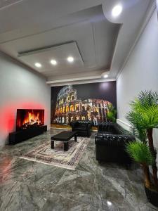 a living room with a couch and a fireplace at Luu Hotel in Çorlu