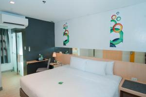 Postel nebo postele na pokoji v ubytování Go Hotels Iligan + 25 fotografií