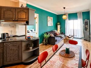 a kitchen and living room with a table and chairs at Bayview in St Julian's