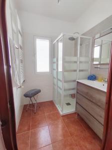 a bathroom with a glass shower and a sink at Casa Mar in Águilas