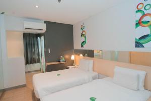 Postel nebo postele na pokoji v ubytování Go Hotels Iligan