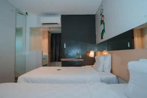 Postel nebo postele na pokoji v ubytování Go Hotels Iligan