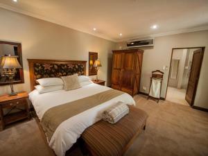 Ein Bett oder Betten in einem Zimmer der Unterkunft Fairview Hotels,Spa & Golf Resort