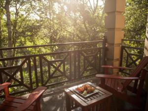 a plate of fruit on a table on a balcony at Fairview Hotels,Spa & Golf Resort in Tzaneen