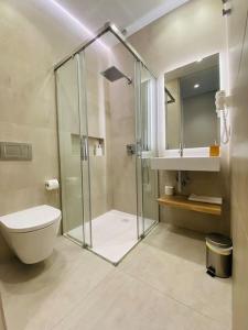 a bathroom with a shower and a toilet and a sink at ATSEDEN apartment aire condicionado - Opción a parking - in San Sebastián