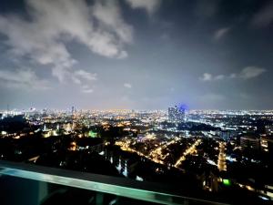 a view of a city at night at Grande Cariibbean Pattaya by Thita in Pattaya South