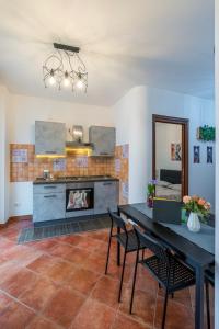 a living room with a table and a fireplace at VERY WELL apartment in Porto Torres