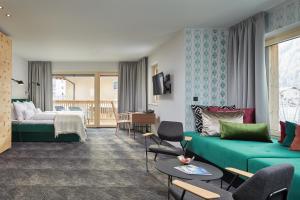 Postel nebo postele na pokoji v ubytování HUBER's Boutiquehotel