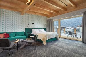Postel nebo postele na pokoji v ubytování HUBER's Boutiquehotel