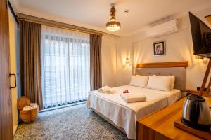 Кровать или кровати в номере Jasmine Marmaris