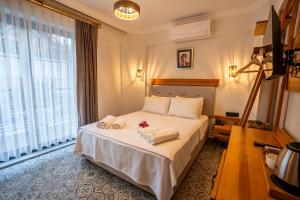 Кровать или кровати в номере Jasmine Marmaris