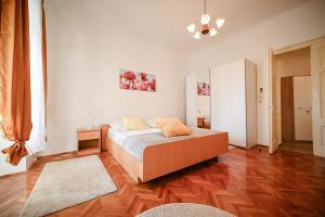 a bedroom with a bed and a mirror on the wall at Seafront Apartment Ičići in Ičići