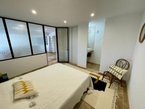 Łóżko lub łóżka w pokoju w obiekcie Villa Terra Vecchia, 6 ou 12 personnes, vue imprenable, piscine chauffée