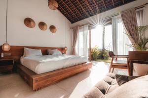 Postel nebo postele na pokoji v ubytování Sundance Residence Nusa Penida + 37 fotografií